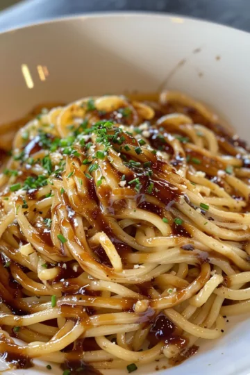 french onion pasta with Teriyaki Glaze taken with iphone 15 pro max --iw 2 --ar 4:5 --v 6.0 --raw