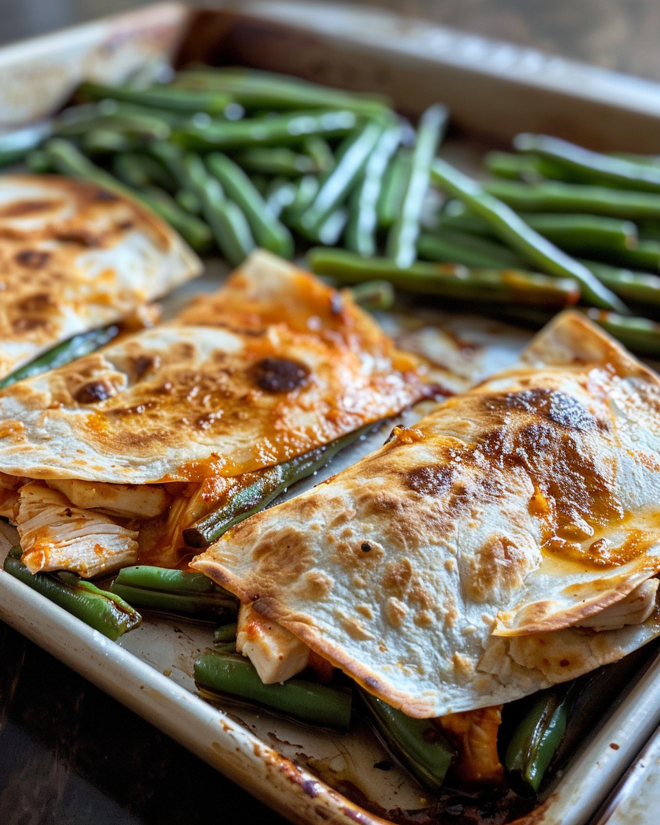 Golden crispy sheet pan chicken quesadillas ready to serve