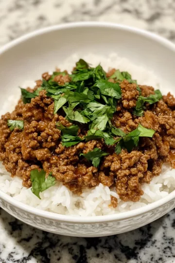 Ground Beef Hot Honey Bowl Spicy, Sweet taken with iphone 15 pro max --iw 2 --ar 4:5 --v 6.1 --raw