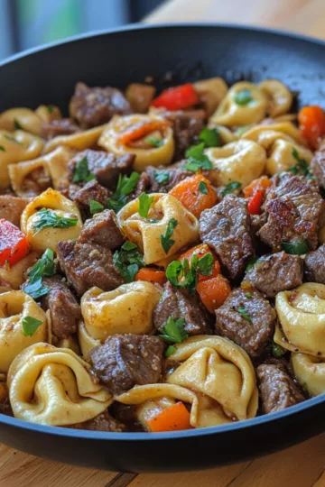 The Best Garlic Steak & Cheese Tortellini Skillet taken with iphone 15 pro max --iw 2 --ar 4:5 --v 6.1 --raw