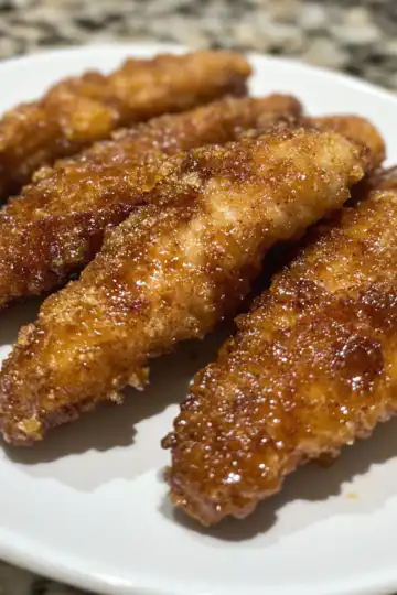 Bacon Brown Sugar Chicken Tenders taken with iphone 15 pro max --iw 2 --ar 4:5 --v 6.1 --raw