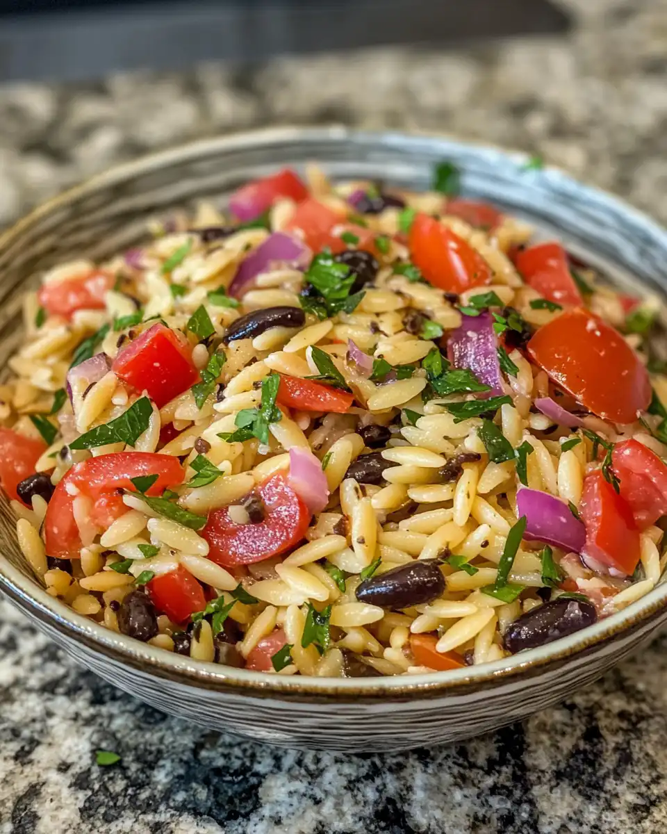 Ingredients for balsamic orzo salad including olive oil, balsamic vinegar, and fresh spinach
