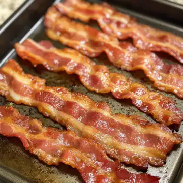 Best Oven Baked Bacon taken with iphone 15 pro max --iw 2 --ar 4:5 --v 6.1 --raw