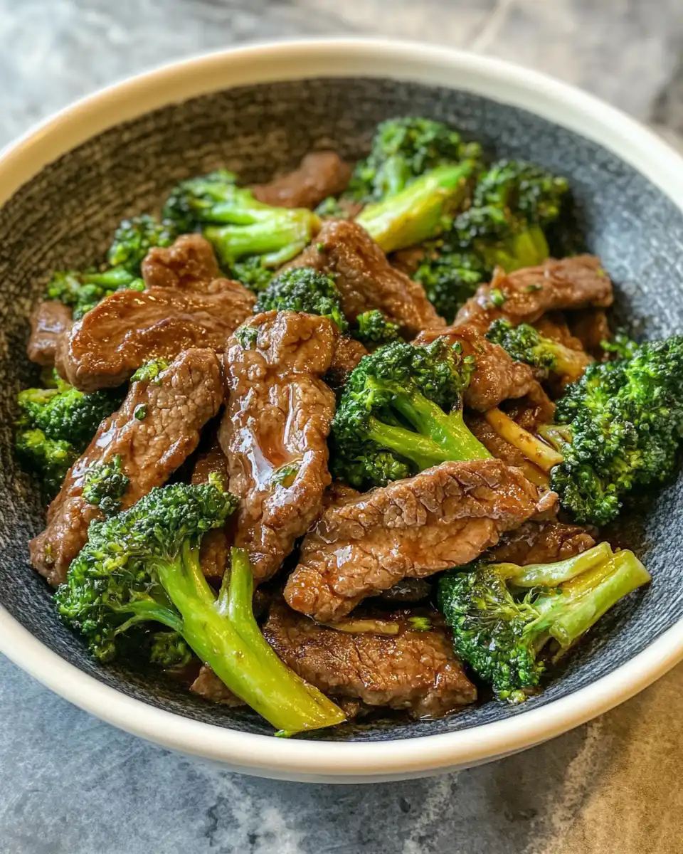 Fresh ingredients for beef with broccoli including broccoli florets and seasonings