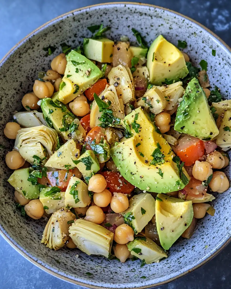 Final plated chickpea avocado salad with apple and artichoke hearts