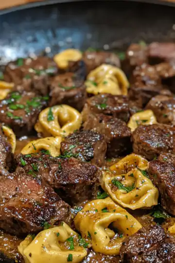 cowboy butter tortellini steak bites taken with iphone 15 pro max --iw 2 --ar 4:5 --v 6.1 --raw