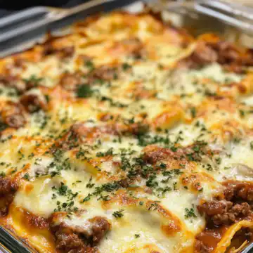 Decadent Beef And Cheese Ravioli Casserole taken with iphone 15 pro max --iw 2 --ar 4:5 --v 6.1 --raw