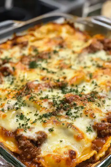 Decadent Beef And Cheese Ravioli Casserole taken with iphone 15 pro max --iw 2 --ar 4:5 --v 6.1 --raw