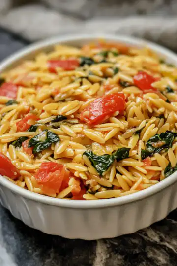 Dump And Bake Vegan Tuscan Orzo taken with iphone 15 pro max --iw 2 --ar 4:5 --v 6.1 --raw