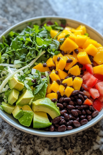 Epic Summer Salad With Black Beans, Mango And Avocado taken with iphone 15 pro max --iw 2 --ar 4:5 --v 6.1 --raw