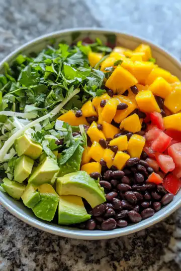 Epic Summer Salad With Black Beans, Mango And Avocado taken with iphone 15 pro max --iw 2 --ar 4:5 --v 6.1 --raw