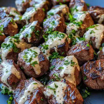 garlic butter steak bites with parmesan cream sauce taken with iphone 15 pro max --iw 2 --ar 4:5 --v 6.1 --raw