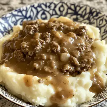 ground beef and gravy over mashed potatoes cookedbymomy taken with iphone 15 pro max --iw 2 --ar 4:5 --v 6.1 --raw