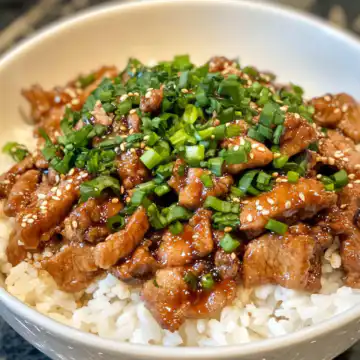 honey garlic pork rice bowl taken with iphone 15 pro max --iw 2 --ar 4:5 --v 6.1 --raw
