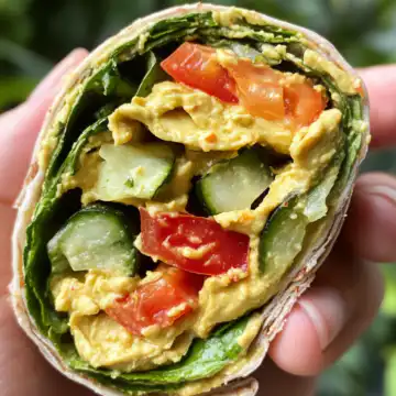 Hummus Veggie Wrap taken with iphone 15 pro max --iw 2 --ar 4:5 --v 6.1 --raw