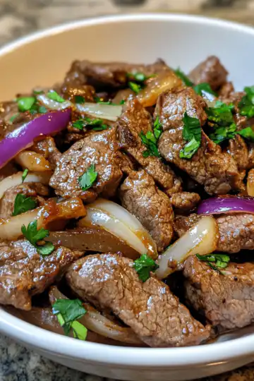 make pepper steak with onions tonight taken with iphone 15 pro max --iw 2 --ar 4:5 --v 6.1 --raw