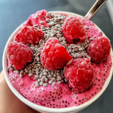 raspberry chia pudding taken with iphone 15 pro max --iw 2 --ar 4:5 --v 6.1 --raw