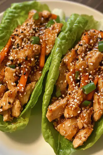 Sesame Chicken Lettuce Wraps taken with iphone 15 pro max --iw 2 --ar 4:5 --v 6.1 --raw