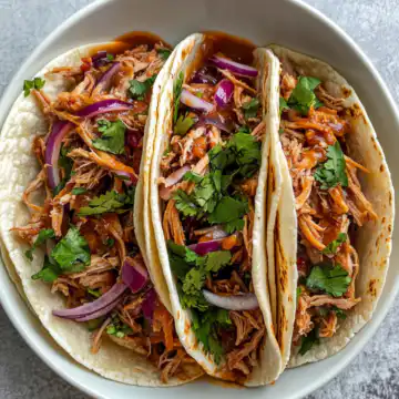 Slow Cooker Pulled Pork Tacos taken with iphone 15 pro max --iw 2 --ar 4:5 --v 6.1 --raw