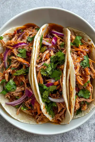 Slow Cooker Pulled Pork Tacos taken with iphone 15 pro max --iw 2 --ar 4:5 --v 6.1 --raw