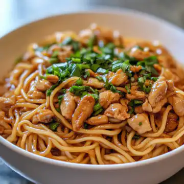sticky garlic chicken noodles taken with iphone 15 pro max --iw 2 --ar 4:5 --v 6.1 --raw
