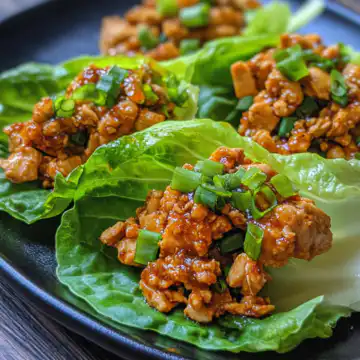 Szechuan Chicken Lettuce Wraps taken with iphone 15 pro max --iw 2 --ar 4:5 --v 6.1 --raw