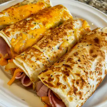 Air Fryer Ham and Cheese Wraps taken with iphone 15 pro max --iw 2 --ar 4:5 --v 6.0 --raw