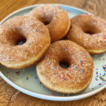 Apple Cinnamon Baked Doughnuts taken with iphone 15 pro max --iw 2 --ar 4:5 --v 6.0 --raw