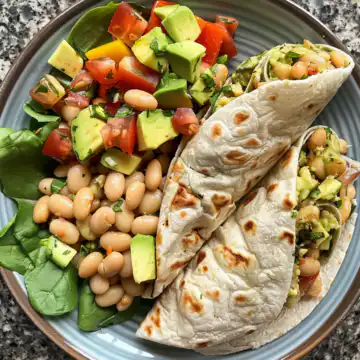 Avocado And White Bean Salad Wraps taken with iphone 15 pro max --iw 2 --ar 4:5 --v 6.0 --raw