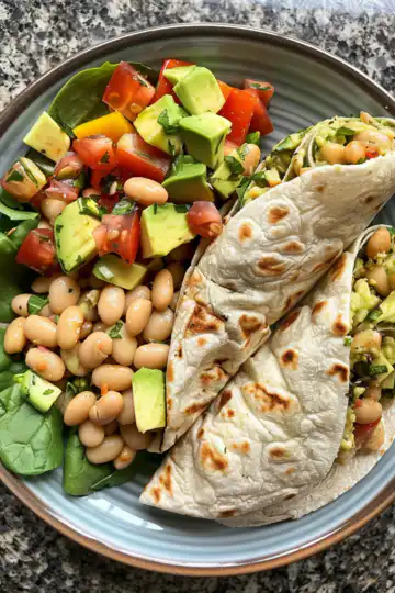 Avocado And White Bean Salad Wraps taken with iphone 15 pro max --iw 2 --ar 4:5 --v 6.0 --raw