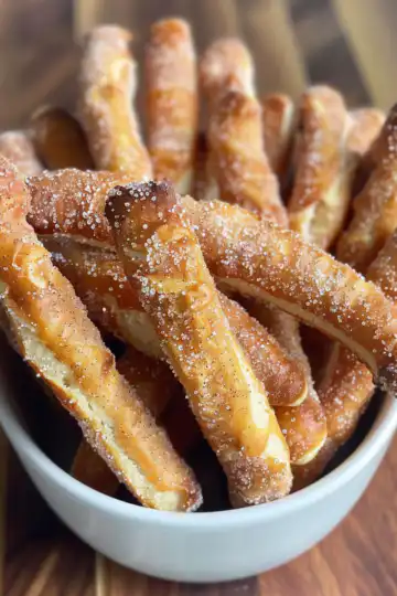 Baked Cinnamon Sugar Pretzel Sticks taken with iphone 15 pro max --iw 2 --ar 4:5 --v 6.0 --raw