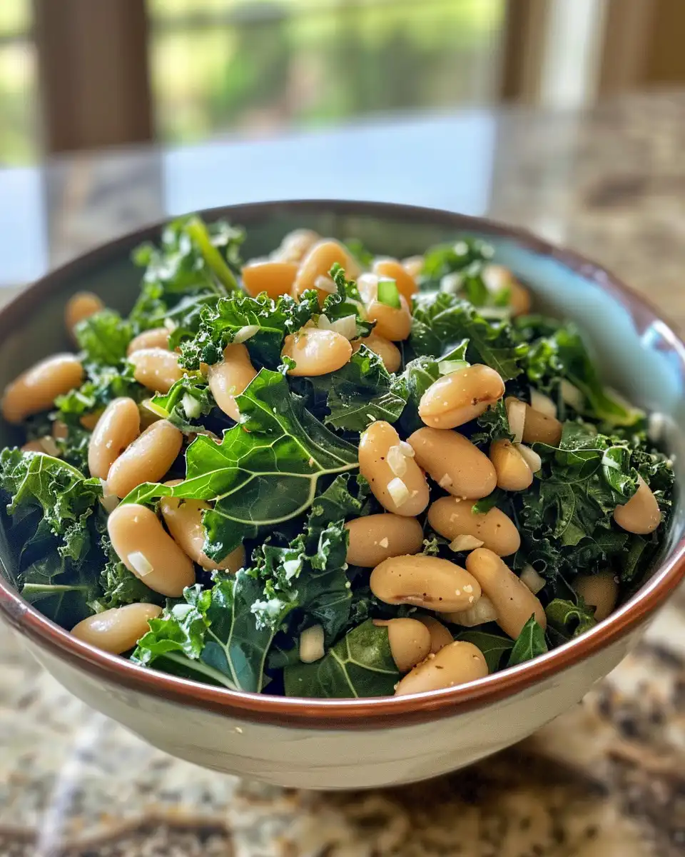 Ingredients for kale and white bean salad including kale, beans, avocado, seeds, and dressing