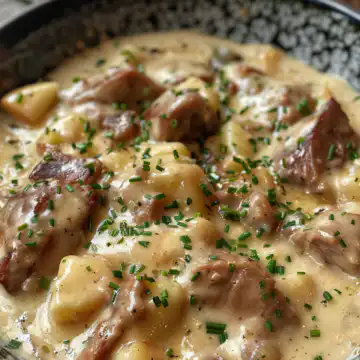 Creamy Pork and Apple Casserole with Cider taken with iphone 15 pro max --iw 2 --ar 4:5 --v 6.0 --raw