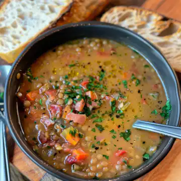 French Lentil Bacon Soup taken with iphone 15 pro max --iw 2 --ar 4:5 --v 6.0 --raw