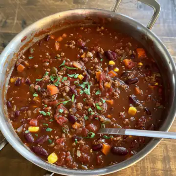 Hearty Vegan Chili taken with iphone 15 pro max --iw 2 --ar 4:5 --v 6.0 --raw