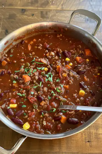 Hearty Vegan Chili taken with iphone 15 pro max --iw 2 --ar 4:5 --v 6.0 --raw
