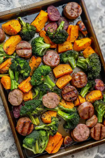 Sheet Pan Sausage, Broccoli, & Sweet Potatoes taken with iphone 15 pro max --iw 2 --ar 4:5 --v 6.0 --raw