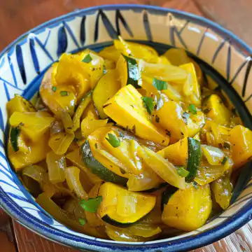 Stewed Summer Squash And Sweet Onions taken with iphone 15 pro max --iw 2 --ar 4:5 --v 6.0 --raw