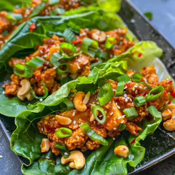 Sweet And Spicy Cashew Chili Lettuce Wraps taken with iphone 15 pro max --iw 2 --ar 4:5 --v 6.0 --raw