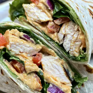 Chicken and Hummus Veggie Wraps taken with iphone 15 pro max --iw 2 --ar 4:5 --v 6.1 --raw