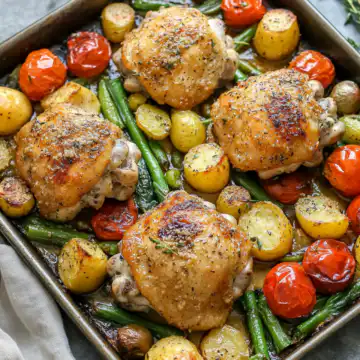 Sheet Pan Parmesan Garlic Chicken Thighs with Veggies taken with iphone 15 pro max --iw 2 --ar 4:5 --v 6.1 --raw